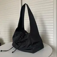 在飛比找樂天市場購物網優惠-日本無印良品側背包黑色尼龍帆布包休閒酷慵懶包包女夏季大容量百