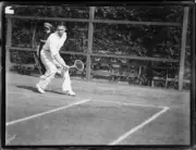 Cliff Sproule playing a backhand return by a fence, NSW, 22 Februa- Old Photo
