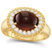 Oval Garnet and 0.38 CT. T.W. Natural Diamond Rope Frame Ring in Solid 10K Yellow Gold