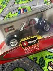 NEW IN BOX Diecast Car Bburago Star Collection Black SMART ROADSTER 1:24 #16074