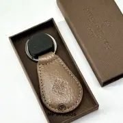 Patek Philippe Heritage Brown Calatrava Emblem Keychain - AD VIP Gift