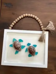 Adorable twin sea turtles on white frame with beaded hanger handmade