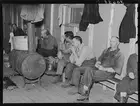 Photo:Lumberjacks waiting for the dinner horn. Camp near Effie, Minnesota