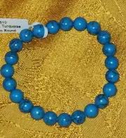 Turquoise 2 1/2-inch 8 mm round beads on an elastic bracelet