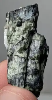 Natural unusual formation green chatoyant and etched tourmaline crystal