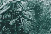 Vietnam War Photos -- Soldier Throws Hand Grenade
