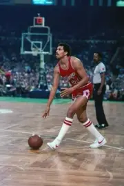 Reggie Theus Chicago Bulls moves the ball up court during a game a- Old Photo