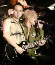Singer songwriter Pink performs with guitarist Raphael Moiera duri - Old Photo