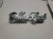 NOS 1973-1977 Chevrolet Monte Carlo Header Panel Emblem NOS 325272 GM OEM