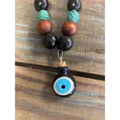 Evil eye potion spell intention jar with wooden beads
