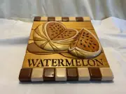 Hand crafted solid wood intarsia wall hanging featuring watermelon