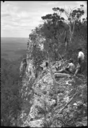 Queensland Two men on a rock ledge looking into a valley Consuelo - Old Photo