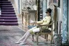 Audrey Hepburn sitting on an old chair in How to Steal a Million 1- Old Photo