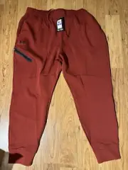 Men's UA Unstoppable FLEECE Sweatpants earthen Orange/black XL