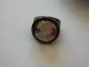 Master carved carnelian shell cameo bezel set into black ceramic 5.5