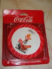 SET OF FOUR COCA COLA PLASTIC COASTERS WITH VINTAGE ZING AD -NEW