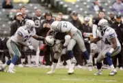 Wide receiver Tim Brown Oakland Raiders has the ball knocked out o- Old Photo