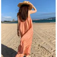 在飛比找蝦皮商城精選優惠-Kayee 度假風橘色吊帶裙 沙灘拍照露背長裙海邊戰裙夏天 