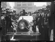 Adventurer Francis Birtles in his vehicle surrounded by a crowd on- Old Photo