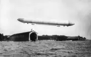 Zeppelin airship flying over hangar an airfield Germany 28 January- Old Photo