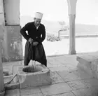 Druze priest draws water from well in Lebanese town Hasbaya 1950s OLD PHOTO