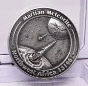 MARTIAN METEORITE WITH COLLECTORS COIN, NORTH WEST AFRICA 13190 MT133