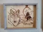 Handmade wood burning art, pyrography of two wolves in moonlight scene