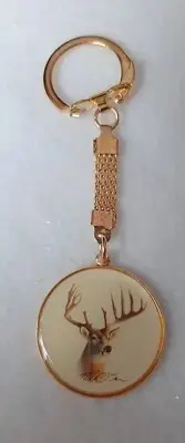 BIG BUCK KEYCHAIN FINISHED IN GOLD WITH HEAVY CHAIN FOB
