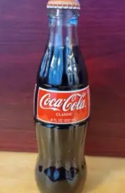 Vintage Coca Cola Classic Red Glass Label Sealed Bottle. Collectable