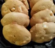 Indulge in the mouth-watering Half Dozen White Chocolate Macadamia Nut cookies!