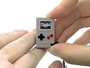 TinyCircuits Thumby (Gray), Tiny Game Console, Playable Programmable Keychain: Electronic Miniature, STEM Learning Tool, Fidget Accessory