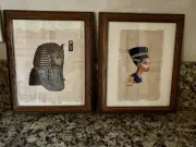 Framed Egyptian hand painted images on papyrus. The pharaoh and Nefertiti.