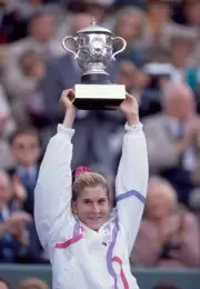 Monica Seles of Yugoslavia lifts the trophy after defeating Steffi- Old Photo 2
