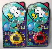2X DINKIE DINO RAKURAKU DINOKUN ELECTRONIC VIRTUAL PET TK-910 YELLOW RED NEW !