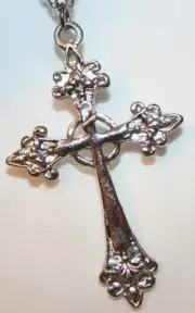 Shiny Festooned Open Aura Silvertone Cross Necklace