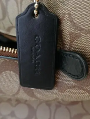 COACH 馬車LOGO F79609 緹花PVC前口袋托特肩背包(卡其黑)