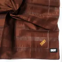 在飛比找momo購物網優惠-【DKNY】簡約滿版LOGO純綿帕巾領巾(咖啡色)