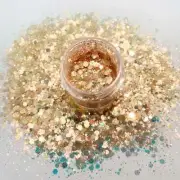 Peachy Opal polyester glitter mix 2 oz. comes in a shaker bottle!