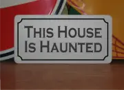 This House is Haunted Metal Sign