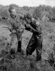 A South Vietnamese soldier beats a farmer 8x10 Vietnam War Photo 36