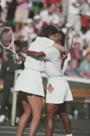 American tennis players Pam Shriver and Zina Garrison embrace aft - Old Photo