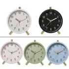 Battery Operated Miniamalists Round Alarm Clock with Gentle Night Light Feature