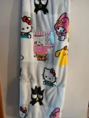 Hello Kitty Plush Throw 50x70 with all her friends in a checked pattern