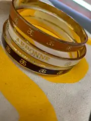 NEW Arbonne set of 3 bangles in zip purse