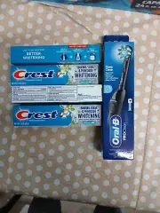 Oral B toothbrush & 4 Crest Toothpaste