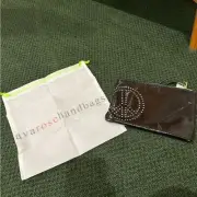 Ava Rose Black Patent Leather Clutch with a peace sign and dust bag