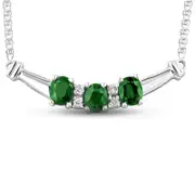 Oval Emerald and 0.07 CT. T.W. Natural Diamond Three Stone Curved Bar Necklace in 14K White Gold - 17.25"