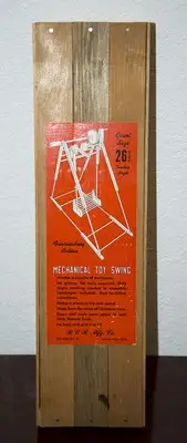 1950'S RCR MFG CO 26 1/2" GIANT SIZE MECHANICAL TOY SWING SEALED IN WOOD BOX MIB