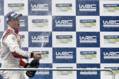 Kris Meeke Citroen celebrates his third place with champagne- 2014 Rally Photo