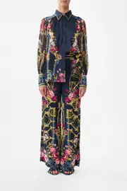 BUTTON THROUGH BLOUSON SLEEVE BLOUSE ORNATE ON A PLATE
